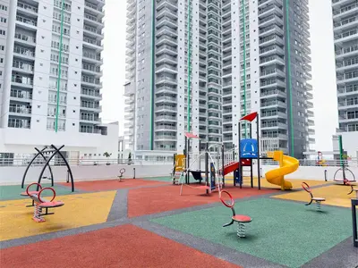 a playground with play equipment in front of tall buildings at Instaworthy 3B3B - 6 pax - F&B & Mart - Chan Sow Lin in Kuala Lumpur