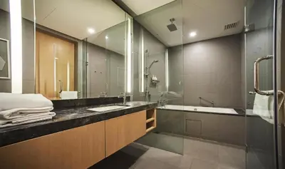 a bathroom with a sink and a tub and a shower at THE APARTMENT at 188 SUITES KLCC in Kuala Lumpur