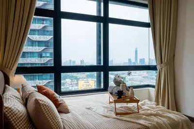 a bedroom with a large window with a large bed at Premium Classy 4Room@Astoria Ampang 12pax 6km KLCC in Kuala Lumpur