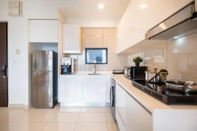 a kitchen with white cabinets and a stainless steel refrigerator at Premium Classy 4Room@Astoria Ampang 12pax 6km KLCC in Kuala Lumpur