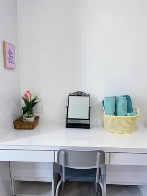 a white desk with two baskets and a chair at Premium Stay at Bukit Bintang City Centre by Premium Stay in Kuala Lumpur