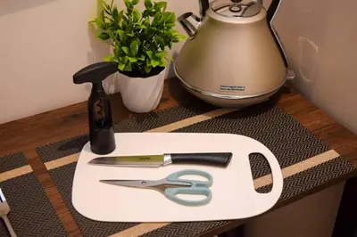 a cutting board with a pair of scissors and a blender at Neu Suites Studio Room - 3km to KLCC, 8 mins walk to LRT in Kuala Lumpur