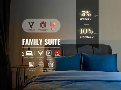 a bedroom with a bed with a poster on the wall at Razak City Residences, Sungai Besi by Rverse Suite in Kuala Lumpur