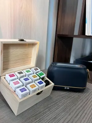a box of colored labels sitting next to a suitcase at Premium Cozy Studio Near Mid Valley in Kuala Lumpur