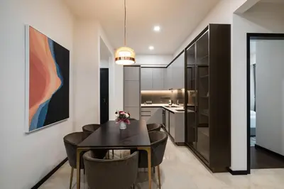 a dining room with a black table and chairs at Opus Signatures ChinaTown 118 in Kuala Lumpur