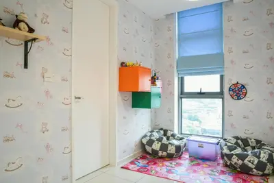 a childs room with two chairs and a window at Home Sweet Home at Robertson Bukit Bintang,trx,klcc,pavilion,lalaport in Kuala Lumpur