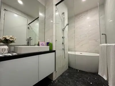 a bathroom with a tub and a sink and a shower at Royce Residences by Romeo Bnb in Kuala Lumpur