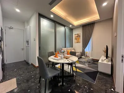 a living room with a table and a couch at Royce Residences by Romeo Bnb in Kuala Lumpur