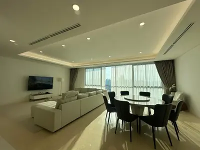 a living room with a couch and a table and chairs at D'Rapport Residences by Manhattan Group in Kuala Lumpur
