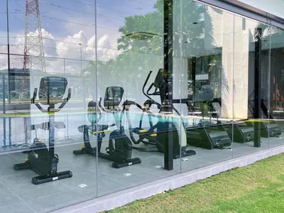 a row of chairs in a glass building at D'Rapport Residences by Manhattan Group in Kuala Lumpur