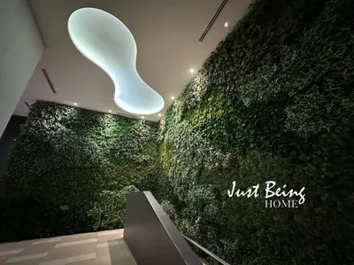 a room with a green wall with a light on it at Just Being Home 5pax 1BR/1BA 1Queen/1Single/1Sofa in Kuala Lumpur