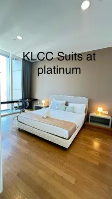 a bedroom with a large bed in a room at KLCC Suites at Platinum in Kuala Lumpur