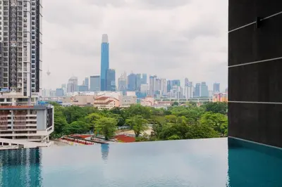 a view of a city skyline from a swimming pool at Muji Home Lavile KL Sunway Velocity \u53cc\u5a01\u6c38\u4e50\u57ce\u4e2d\u6587\u623f\u4e1cPool in Kuala Lumpur
