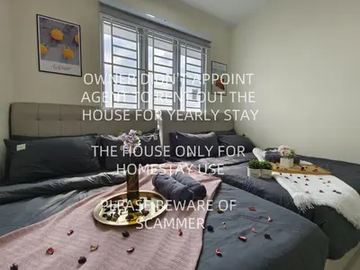 a room with a bed with a table and a window at KLCC VIEW Setapak Homestay 2BR KL view 8pax 15 min to KLCC PV21A R in Kuala Lumpur