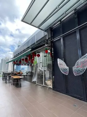 a restaurant with butterflies on the side of a building at D’ Majestic Place by Bimbee in Kuala Lumpur