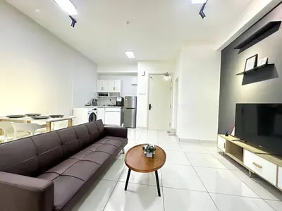 a living room with a couch and a table at Simple Arte Mont Kiara 1B1B 4 Pax Mitec Matrade in Kuala Lumpur