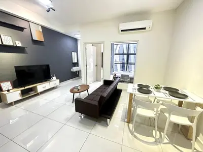 a living room with a couch and a table at Simple Arte Mont Kiara 1B1B 4 Pax Mitec Matrade in Kuala Lumpur