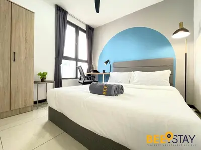 a bedroom with a large white bed with a blue at Balcony KLCC View Kampung Baru Luxurious in Kuala Lumpur