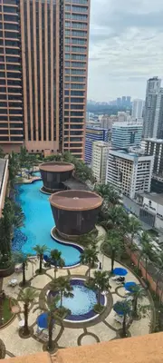 a view of a city with trees and a fountain at Raymond Suites at Times Square kuala Lumpur in Kuala Lumpur