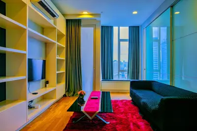 a living room with a couch and a table at SKYWARD SUITES at Platinum KLCC in Kuala Lumpur