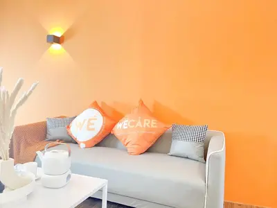 a living room with a couch with pillows on it at The Lonsdale - Bangsar Trade Centre in Kuala Lumpur