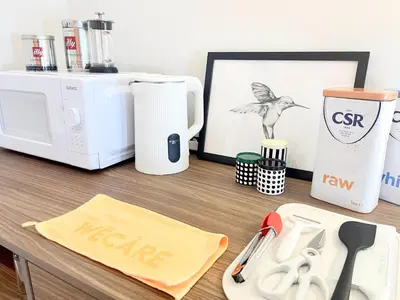 a kitchen counter with a microwave and appliances on it at The Lonsdale - Bangsar Trade Centre in Kuala Lumpur