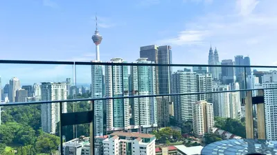 a view of a city skyline from a balcony at Balcony Unit II & The Robertson Residence 33f in Kuala Lumpur