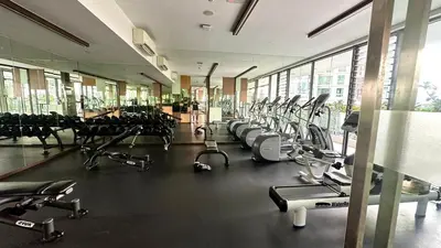 a gym with a lot of treadmills and machines at Balcony Unit II & The Robertson Residence 33f in Kuala Lumpur