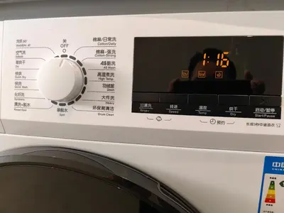 a close up of a washing machine with a white knob at The Tranquil - Bangsar Trade Centre in Kuala Lumpur