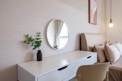 a white dressing table with a mirror and a chair at UNA Residence By Feel Home Malaysia opposite Sunway Velocity Mall in Kuala Lumpur