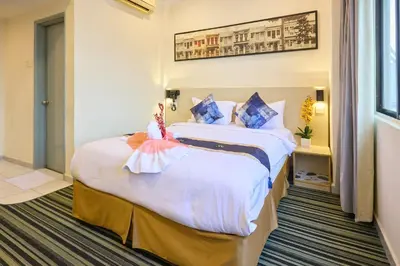 a hotel room with two beds with dolls on them at Hotel Bintang Kuala Lumpur in Kuala Lumpur