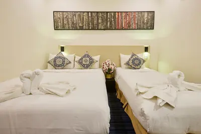 two beds sitting next to each other in a room at Hotel Bintang Kuala Lumpur in Kuala Lumpur
