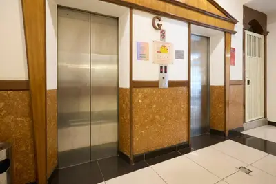 a hallway with two elevators in a building at Hotel Bintang Kuala Lumpur in Kuala Lumpur