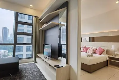 a bedroom with a bed and a television in at MyCrib19*The Robertson KL - Bukit Bintang Pavilion in Kuala Lumpur