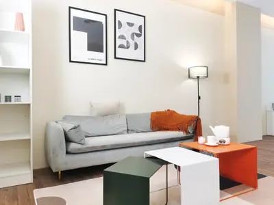 a living room with a couch and a table at The Sandstone - Bangsar Trade Centre in Kuala Lumpur