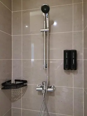 a shower in a bathroom with a shower head at The Sandstone - Bangsar Trade Centre in Kuala Lumpur