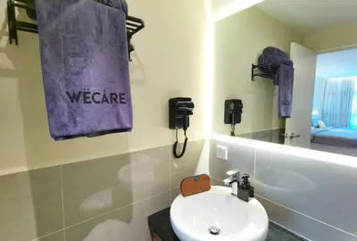 a bathroom with a sink and a towel that says welcome at The Sandstone - Bangsar Trade Centre in Kuala Lumpur