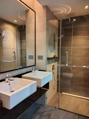 a bathroom with a sink and a shower at James' Studio unit Maison 101 at Heritage Row, Kuala Lumpur in Kuala Lumpur