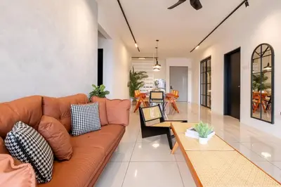 a living room with a couch and a table at RetroJazz Kids House 15pax 4Room in Kuala Lumpur