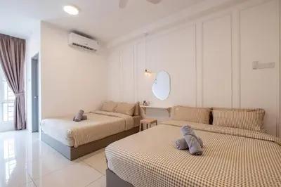 a bedroom with two beds with stuffed animals on them at RetroJazz Kids House 15pax 4Room in Kuala Lumpur