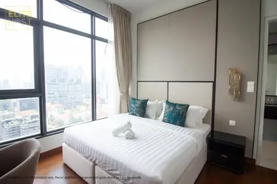 a bedroom with a white bed with a large window at PAVILION EMBASSY KLCC By ELITE HOST in Kuala Lumpur