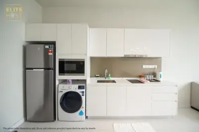 a white kitchen with a refrigerator and a dishwasher at PAVILION EMBASSY KLCC By ELITE HOST in Kuala Lumpur