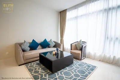 a living room with a couch and a coffee table at PAVILION EMBASSY KLCC By ELITE HOST in Kuala Lumpur
