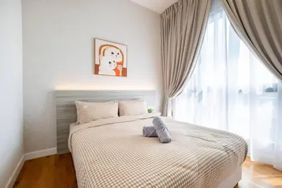 a bedroom with a bed and a window at Kids Wonderland opposite MyTown near TRX Mall MRT in Kuala Lumpur
