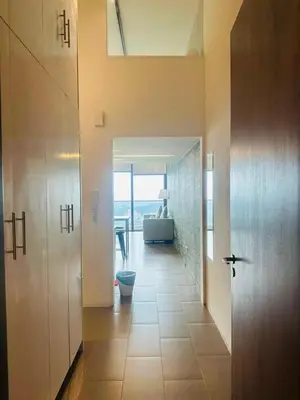 a hallway with a bathroom with a toilet in a house at KL Sentral Bangsar Suites EST by Inam Suites in Kuala Lumpur