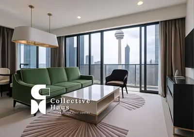 a living room with a green couch and a table at The Platinum 2 Kuala Lumpur By Collective Haus in Kuala Lumpur