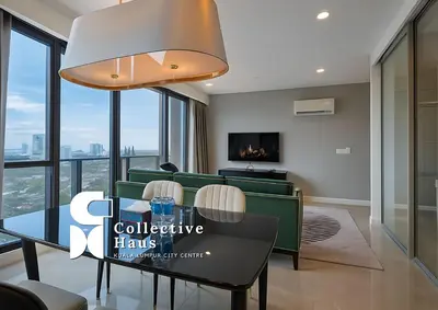 a conference room with a table and chairs at The Platinum 2 Kuala Lumpur By Collective Haus in Kuala Lumpur