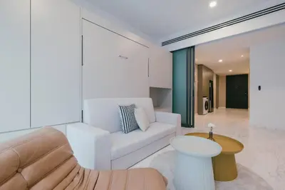 a living room with a couch and a table at NEW! Eaton Infinity SKY POOL KLCC view Pavilion in Kuala Lumpur
