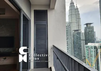 a balcony with a view of a city skyline at The Mews KLCC Kuala Lumpur by Collective Haus in Kuala Lumpur