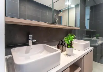 a bathroom with a white sink and a mirror at Novo Ampang by COBNB near Gleneagles in Kuala Lumpur